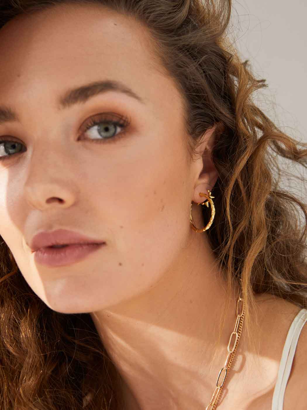 textured-organic-statement-gold-hoops-angle