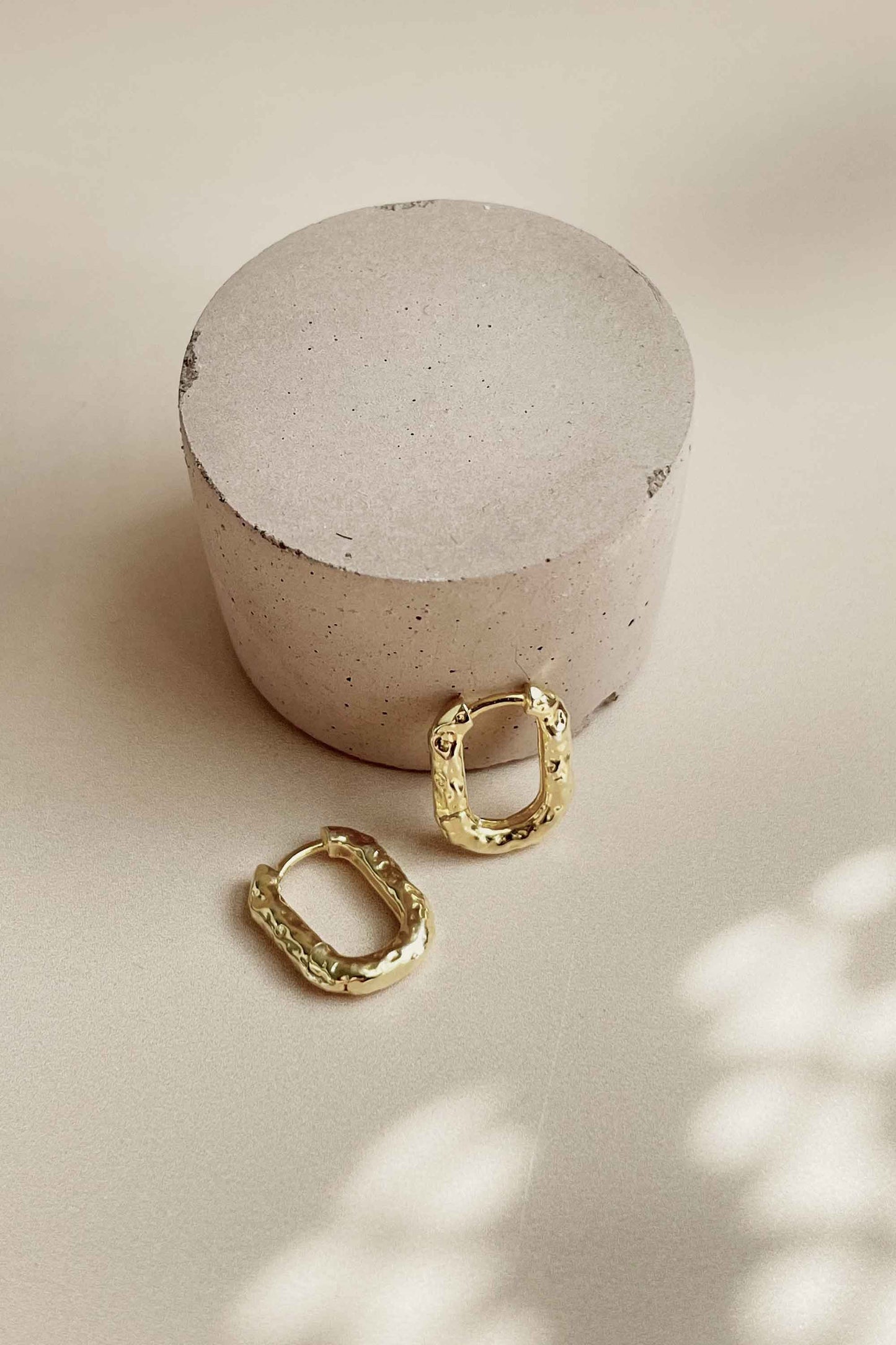     GOLD-TEXTURED-UNIQUE-OVAL-HOOP-EARRING-FLAT-LAY