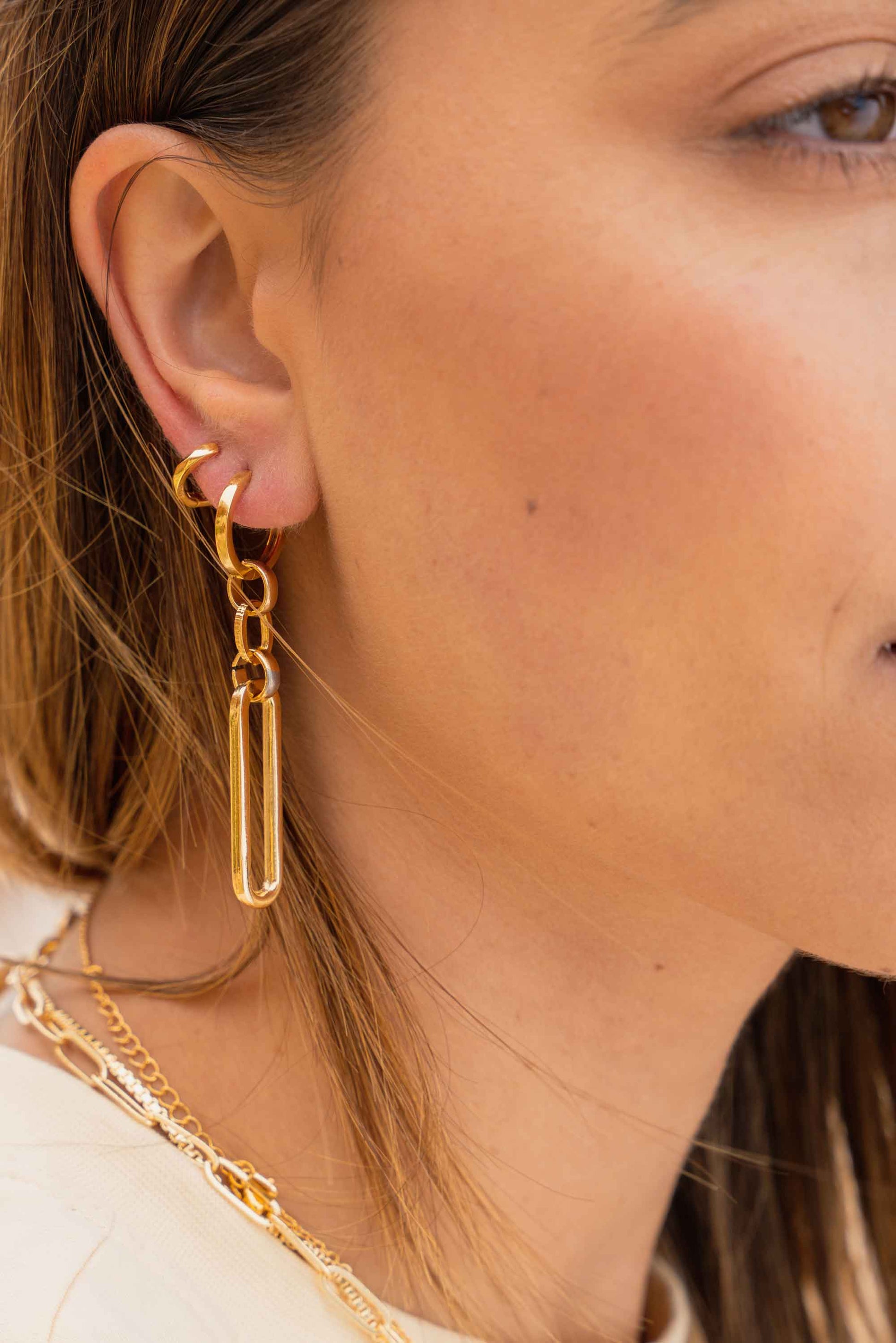 chunky-long-link-oval-gold-hoop-earrings-on-body-close