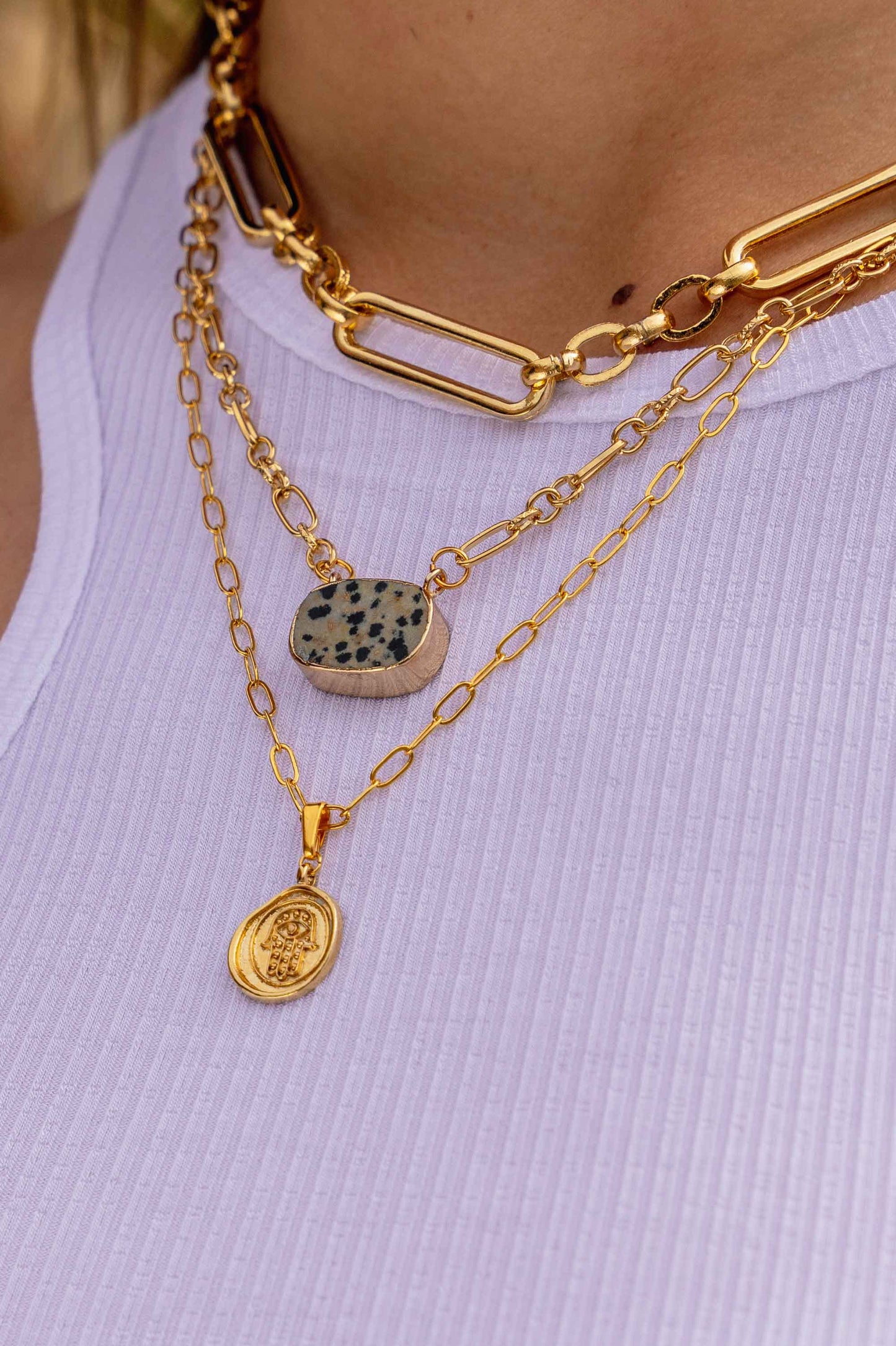 dalmatian-jasper-stone-geometric-chunky-gold-necklace-on-body-close