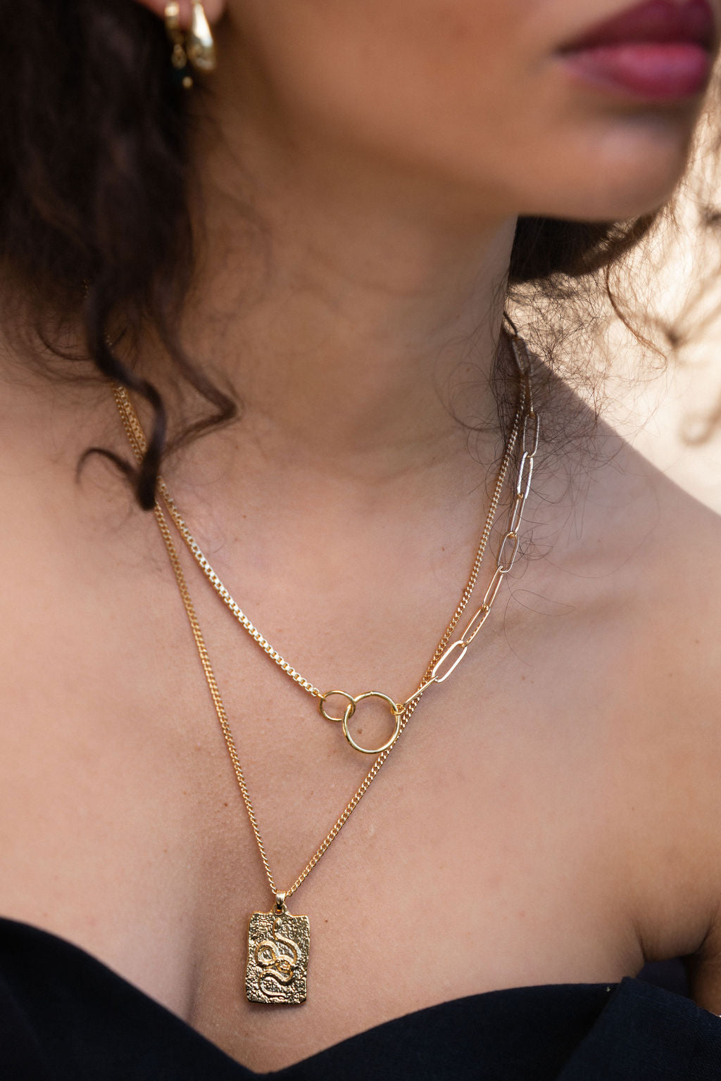 TEXTURED-GOLD-SNAKE-PENDANT-NECKLACE-ON-body