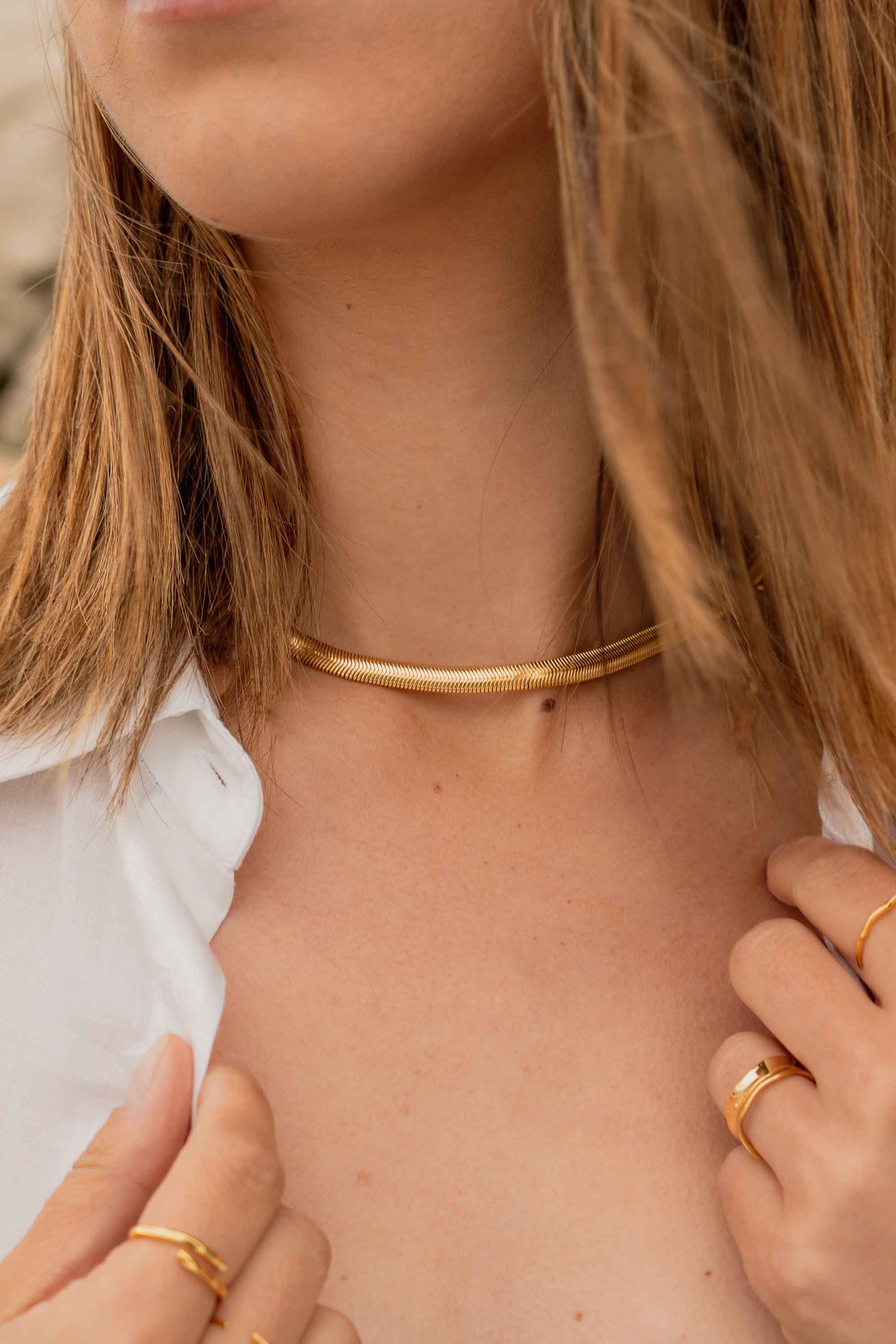 gold-chunky-flat-snake-chain-necklace-on-body