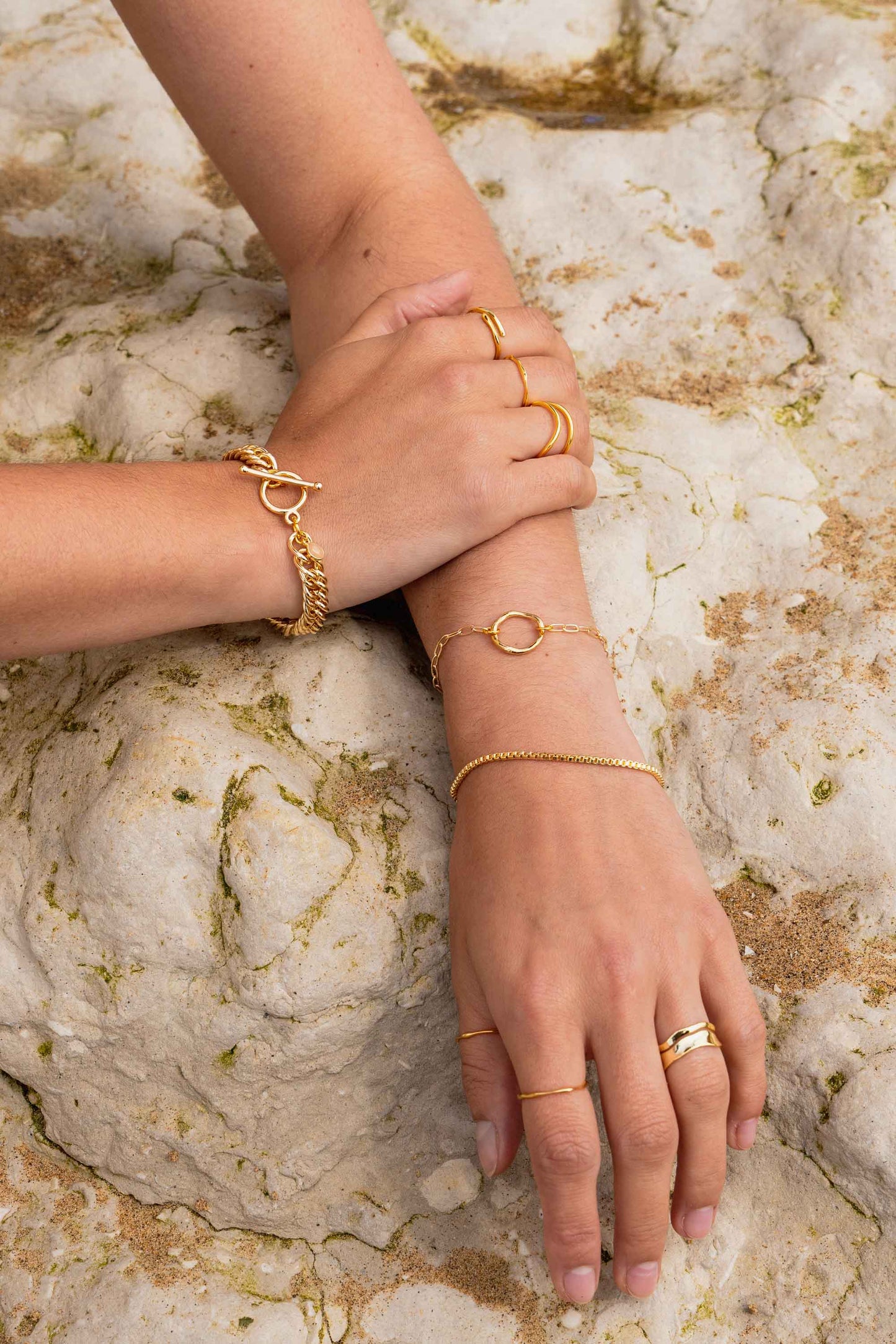 gold-curb-chain-chunky-gold-bracelet-on-body-on-flat